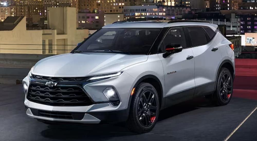 A white 2024 Chevy Blazer is shown parked.