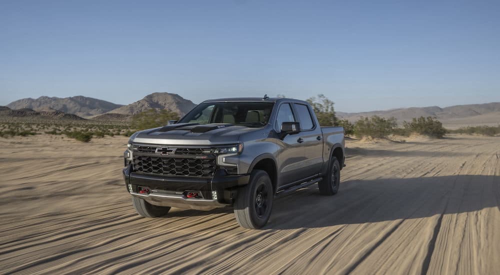 A grey 2024 Chevy Silverado ZR2 is shown from the front at an angle.