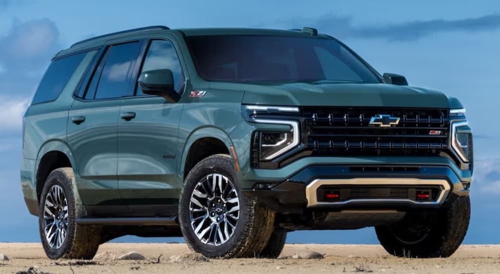 A green 2025 Chevy Tahoe Z71 parked and angled right after visiting a Chevy dealer near Westland.