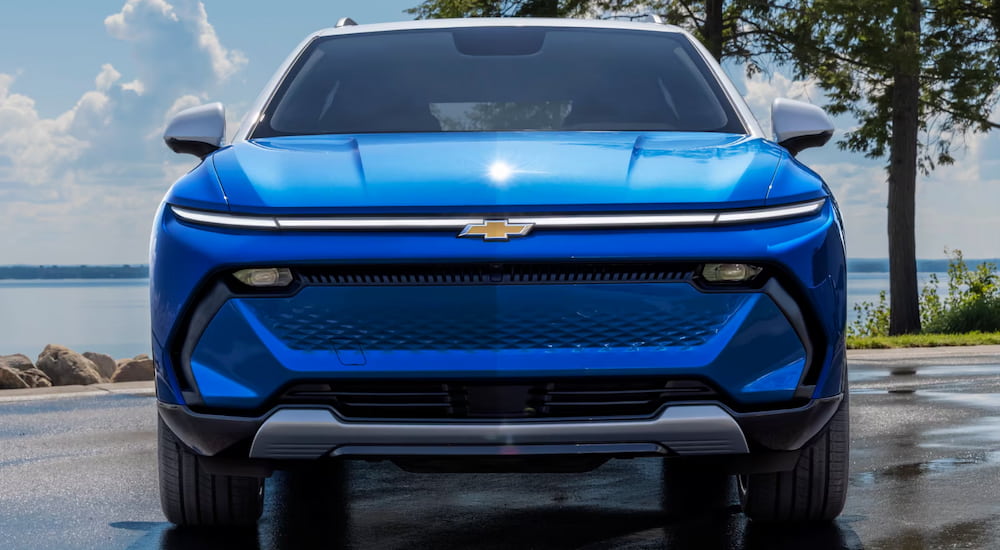 Front view of a parked blue 2025 Chevy Equinox EV.