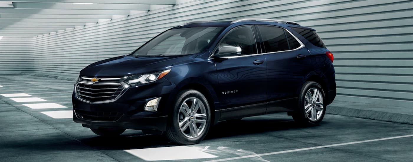 Blue 2020 Chevy Equinox parked in a driveway.