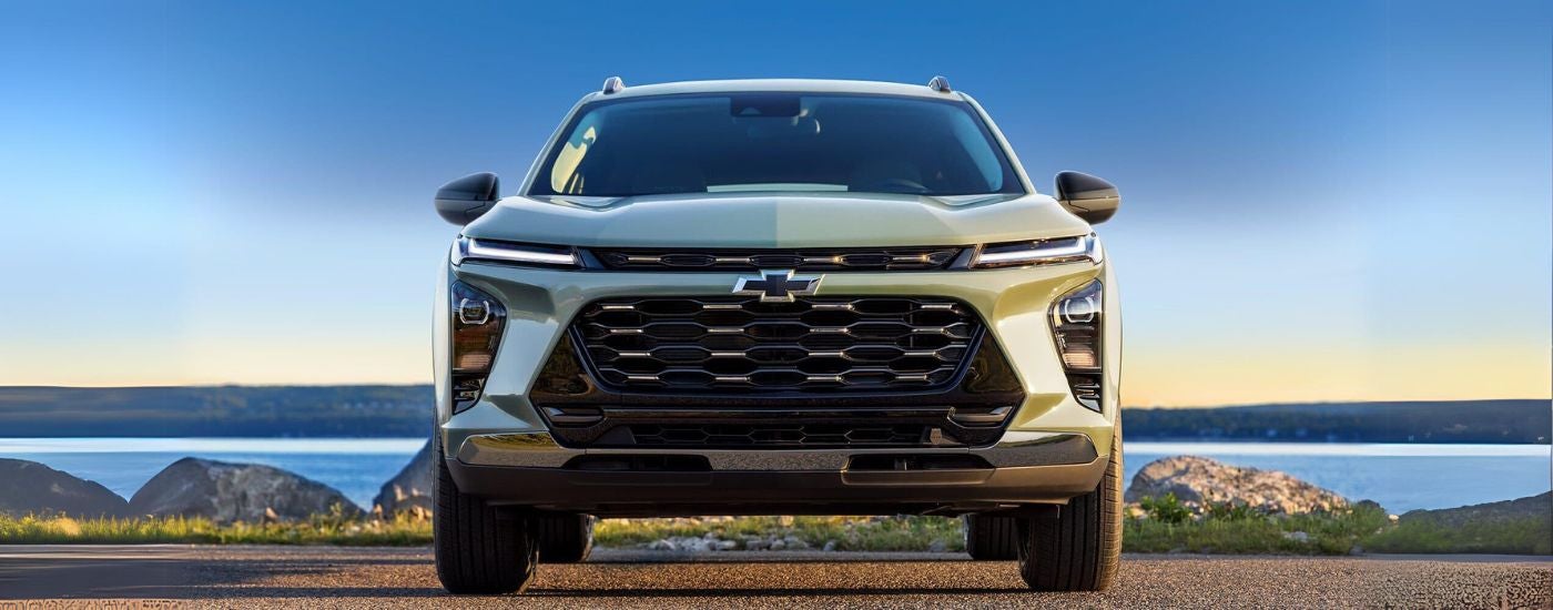 Green 2024 Chevy Trax parked head on by water