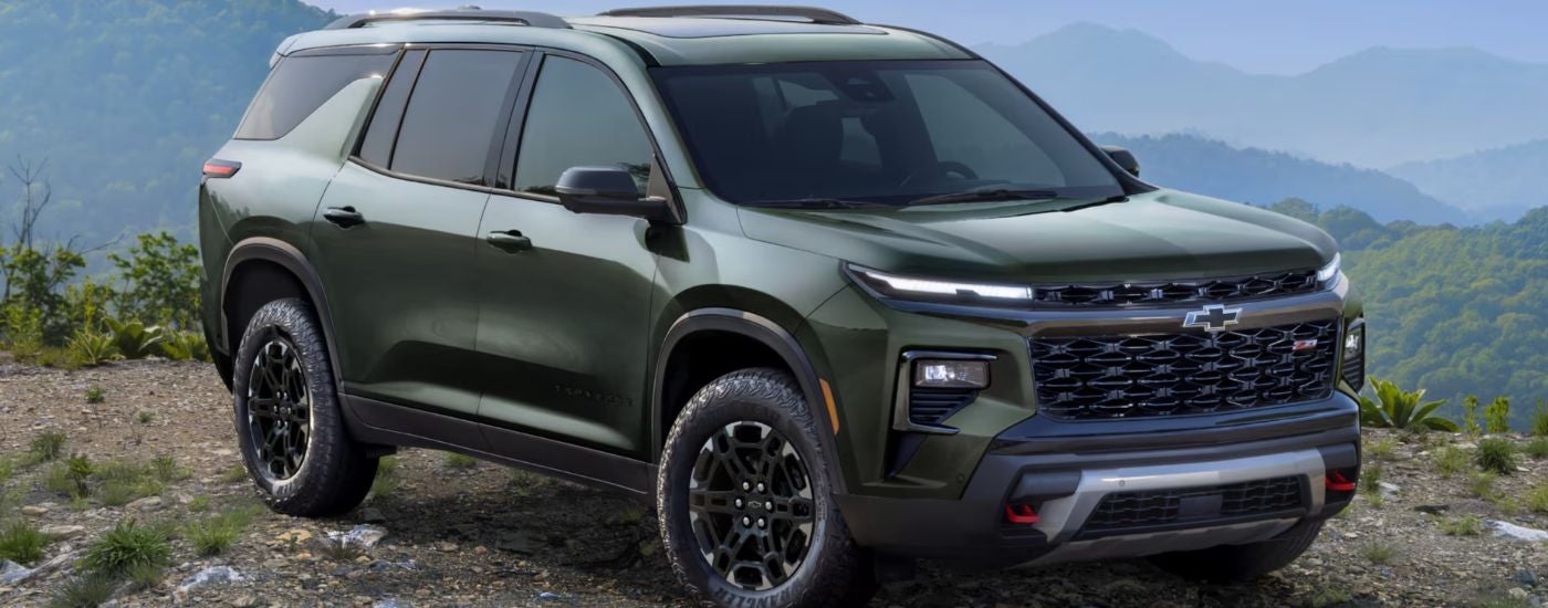 A green 2027 Chevy Traverse Z71 parked off-road.