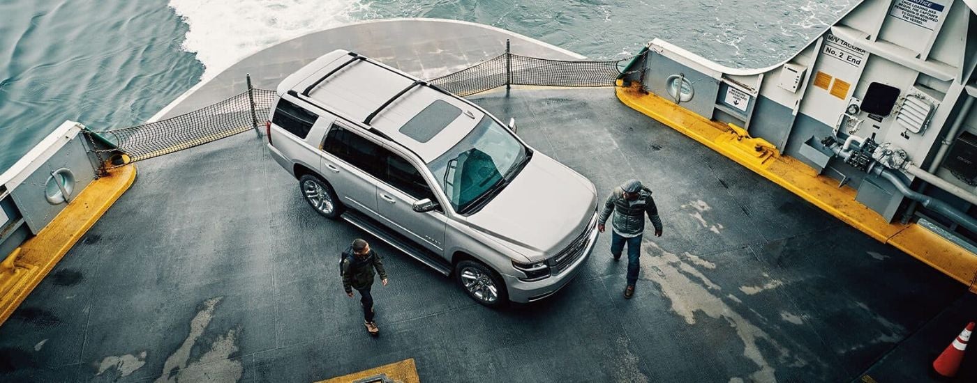 High view of a white 2020 Chevy Tahoe parked on a boat.