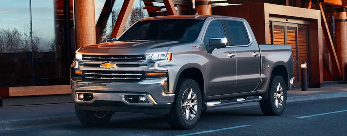 A silver 2019 Chevy Silverado 1500 Z71 parked outside a building.