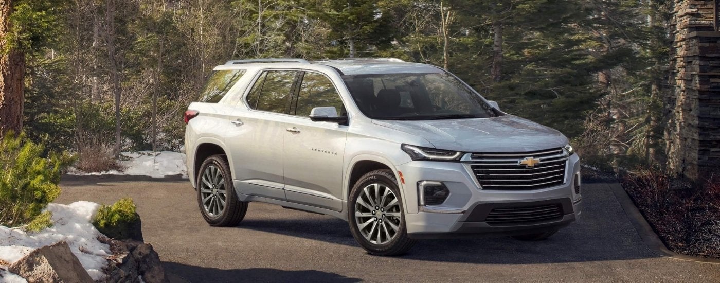 A silver 2022 Chevy Traverse is shown parked on pavement.